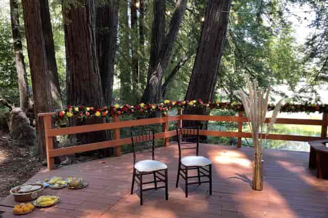 Cozy Cottages outdoor event space with elegant chairs, perfect for weddings and retreats.