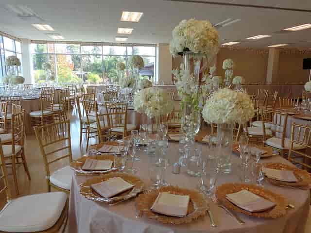 Elegant event space at Bistro Palo Alto with floral centerpieces, perfect for weddings.
