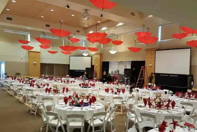 Grand Ballroom in Palo Alto Event Center with red umbrellas, ideal for formal events and presentations.