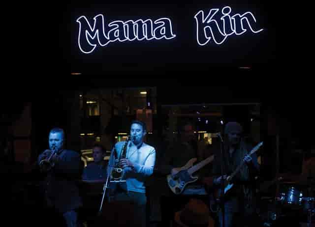 Vibrant live music performance at Mama Kin's Mezzanine, perfect for social events.