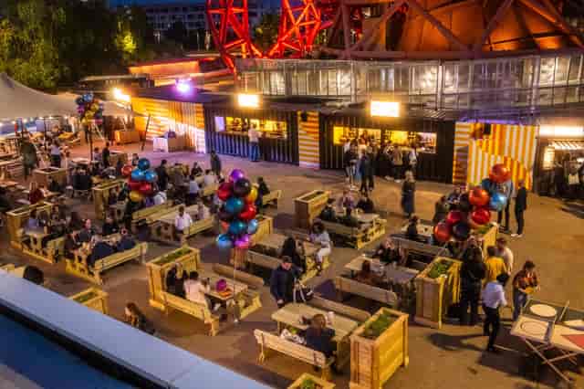 Vibrant outdoor event space with colorful balloons for networking and gatherings.