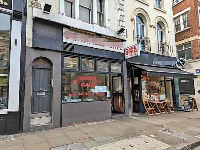 Quaint café exterior with outdoor seating, ideal for networking events and casual meetings.