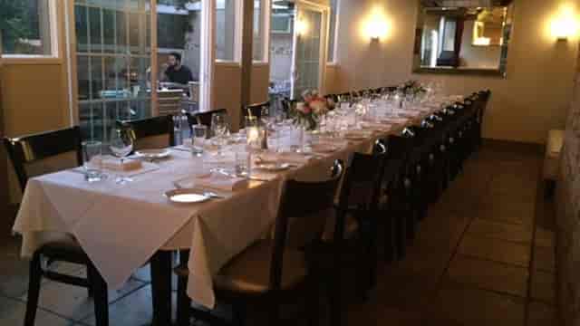 Elegant long dining table at Bellagio Italian Restaurant for intimate gatherings and events.