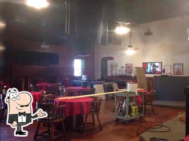 X-Bar Lounge event setup with red tablecloths, ideal for gatherings and meetings.