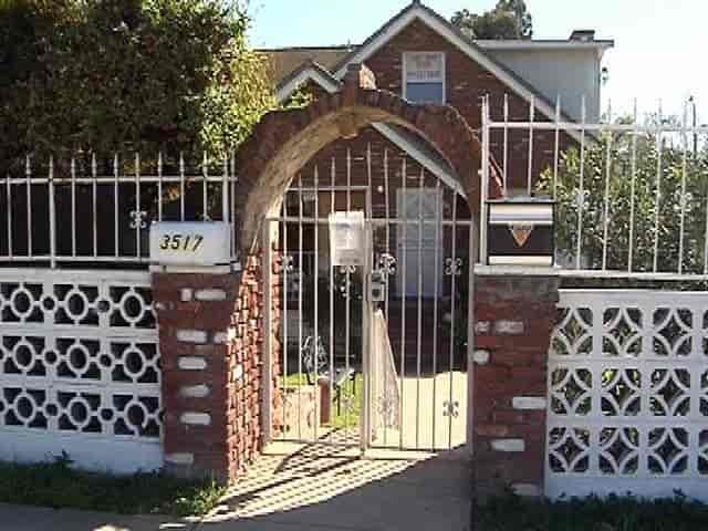 Charming entrance with brick gate for intimate outdoor events at Thad's Private Social Club.