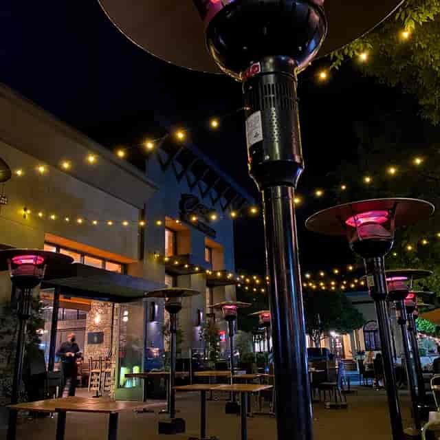 Private room at Willard Hicks Grill, warm outdoor lighting for evening events.