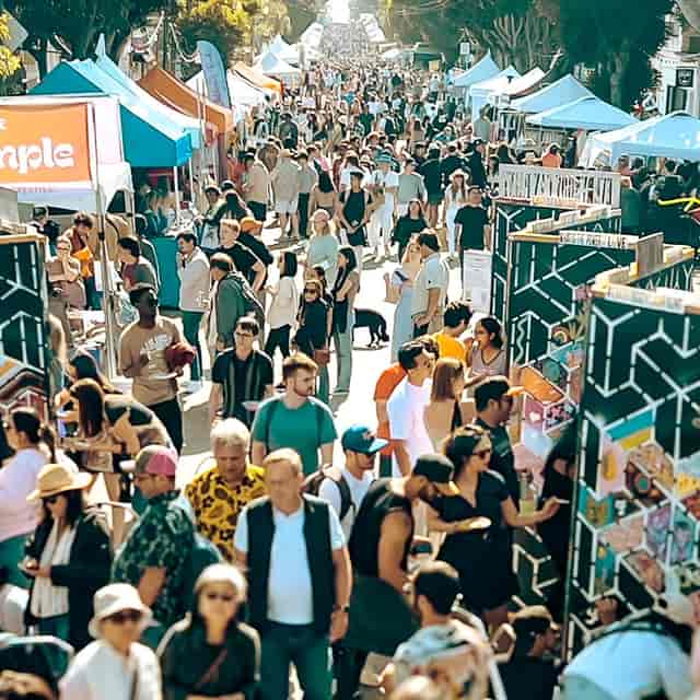 Unity Stage at Union Street Festival, vibrant outdoor event with diverse attendees, networking.