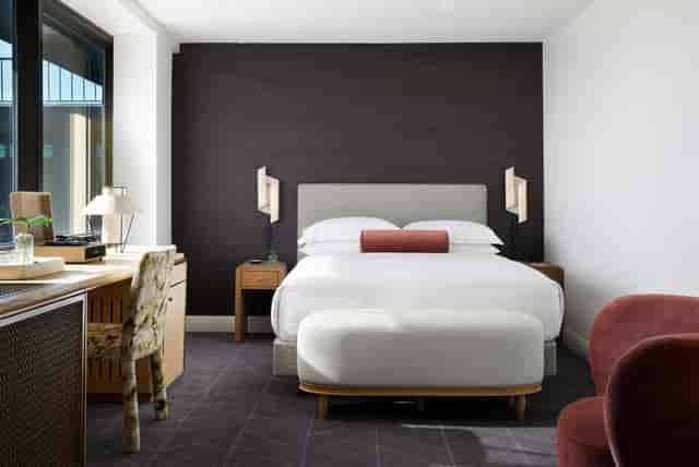 Modern hotel room at Kimpton Alton, ideal for business meetings and events.
