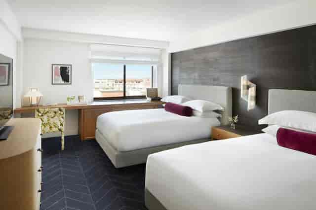 Spa Suite at Kimpton Alton Hotel with two beds, ideal for business events and relaxation.