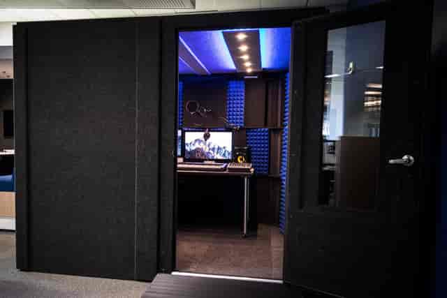 Soundproof meeting pod in Rehearsal Studios, ideal for hybrid events and brainstorming sessions.