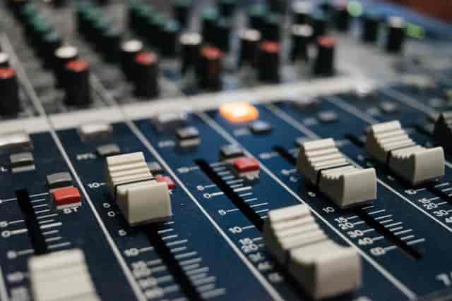 Close-up of a sound mixing console at Rehearsal Studios, San Jose for events.