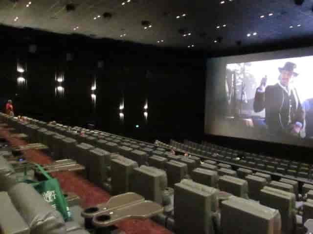 Spacious cinema auditorium with tiered seating for film screenings and corporate events.