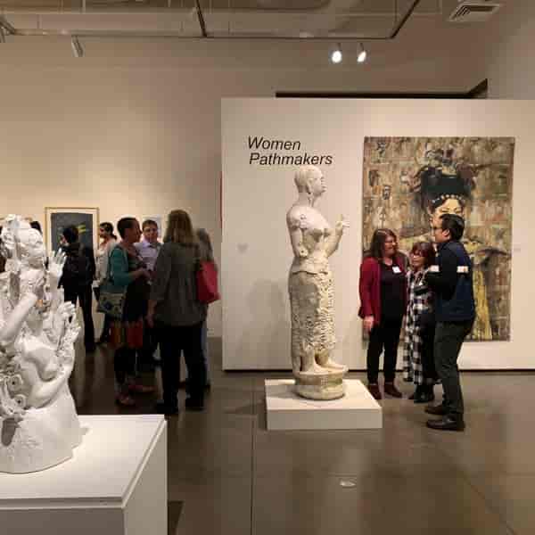 Euphrat Museum of Art exhibition "Women Pathmakers" with vibrant sculptures and networking.