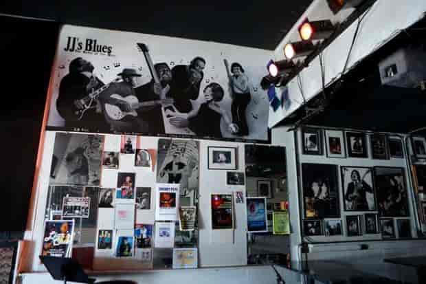 Vibrant JJ's Lounge with musician mural, perfect for live music events and parties.