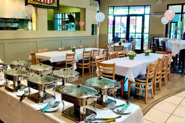 Elegant event space at Capers Eat & Drink with buffet setup for weddings and corporate events.