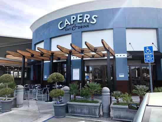 Modern restaurant entrance at Capers Eat & Drink, ideal for events and gatherings.