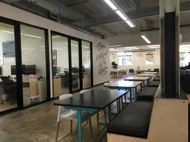 Modern conference room with flexible seating for meetings and workshops at Moniker Commons.