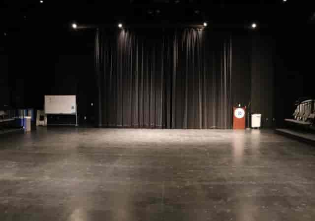 Black Box Theatre at City College: versatile event space with dark curtains for performances.