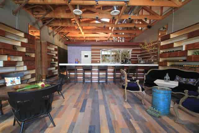 Modern event space with wooden beams for networking and social gatherings at The Rose Wine Bar.
