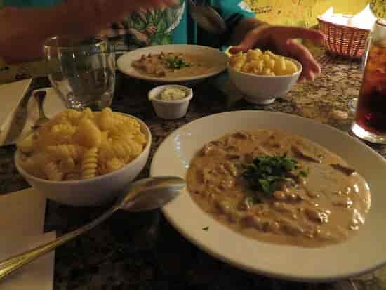 Elegant restaurant dining setup with pasta dishes for events and catering.