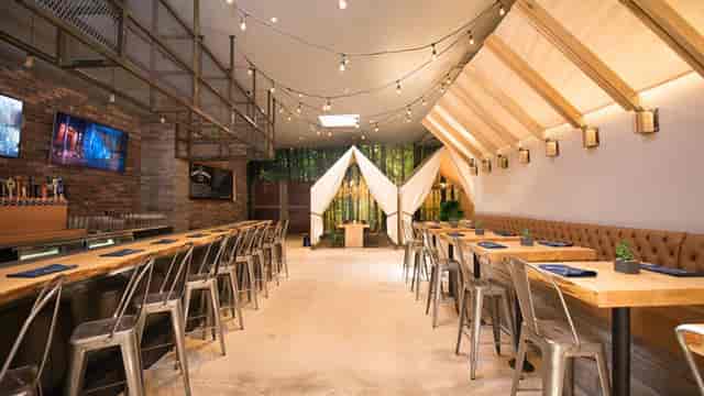 Modern event space with wood accents, ideal for meetings and gatherings.