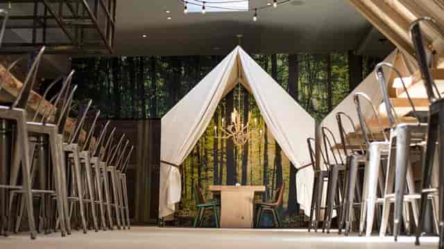 "Unique meeting space at One Door North with tent-like structure for team-building events."