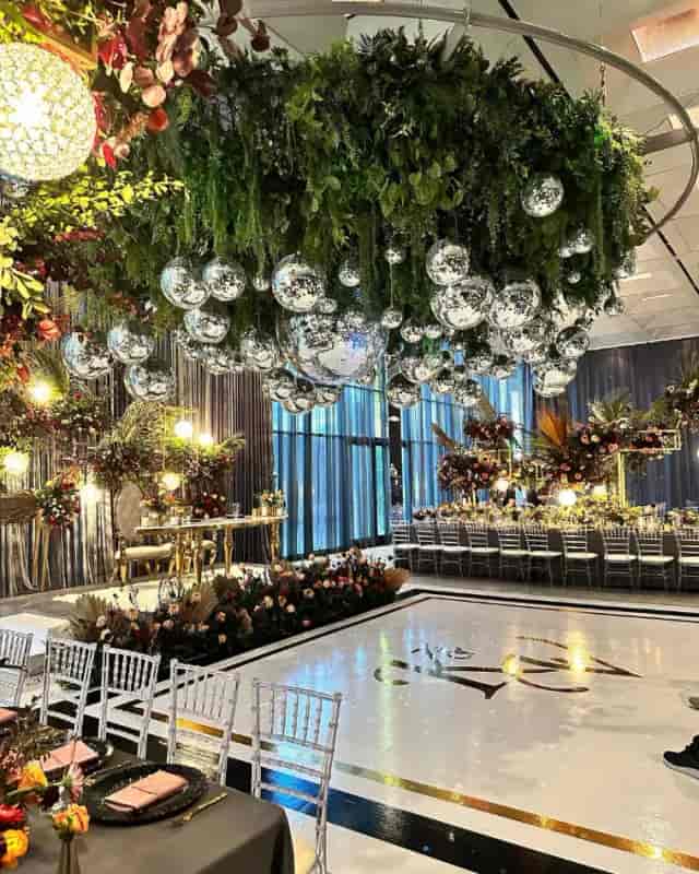 Elegant event space at Morton's The Steakhouse with lush greenery, ideal for weddings and corporate events.