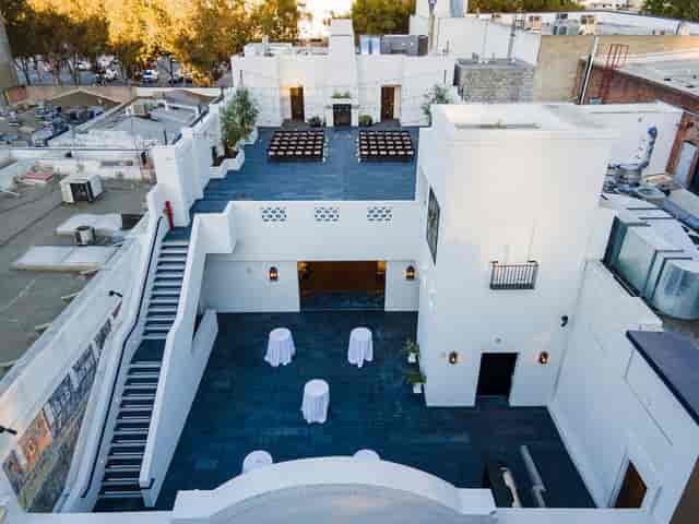 Versatile rooftop event space with modern architecture for gatherings and receptions.