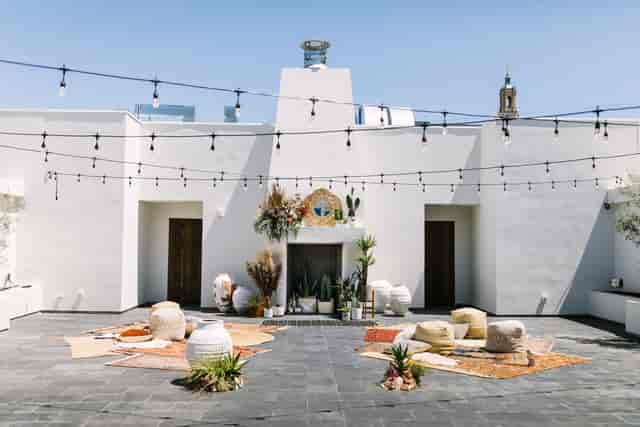 Ashley & Howard's wedding at Blanco Urban Venue with elegant outdoor seating and string lights.