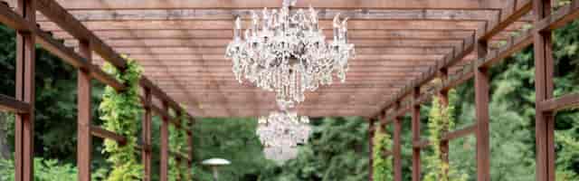 Elegant outdoor event space at Apple Knoll with chandeliers, ideal for weddings and gatherings.