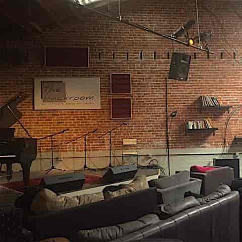 Cozy venue with exposed brick, ideal for music events and small gatherings.