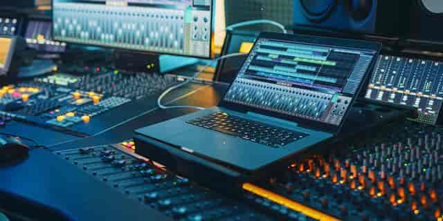 Video and audio production suite with sound mixing console for high-quality event audio.