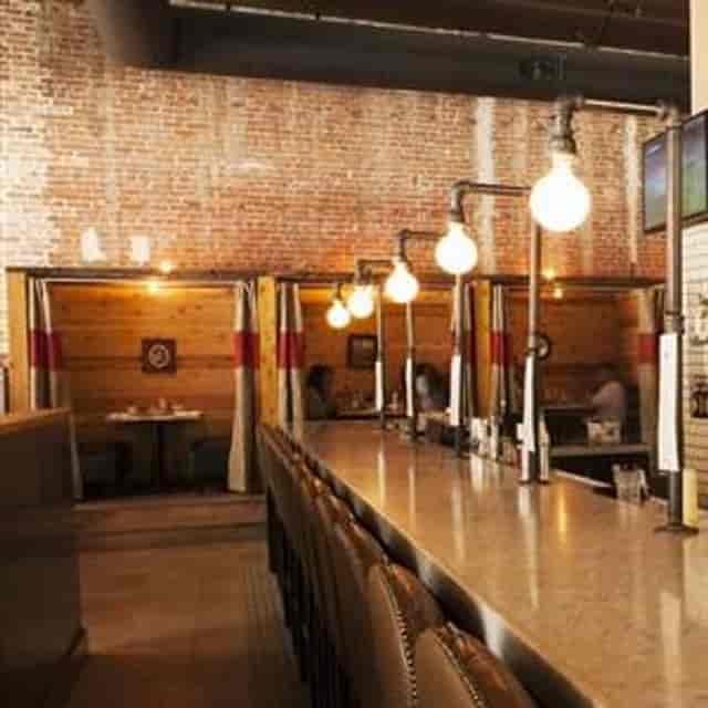 Stylish venue with exposed brick for intimate meetings and networking events.