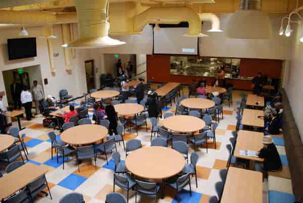 Gary & Mary West Senior Wellness Center event venue with round tables for gatherings.