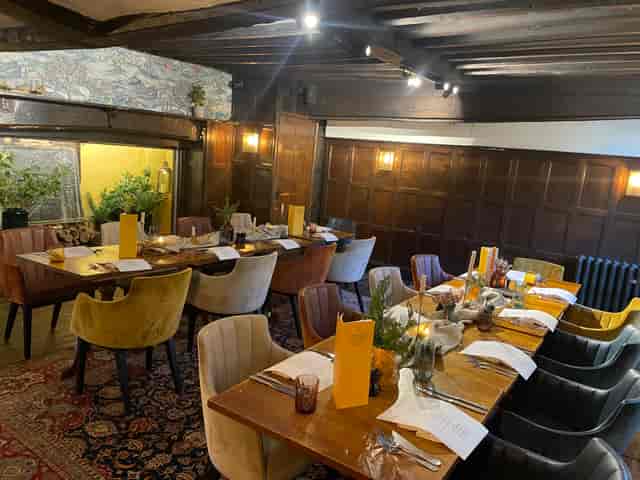 Private dining in The Oak Room at Voco Lythe Hill Hotel, ideal for gatherings and meetings.