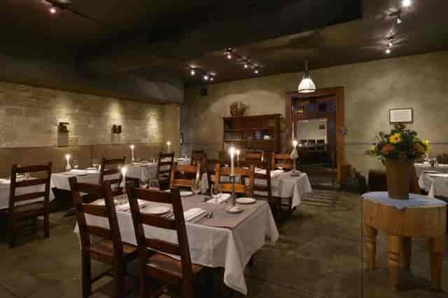 Intimate dining space in The Stone Room, perfect for private events and corporate dinners.