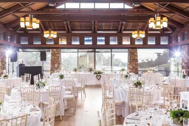 Grand Cypress Meadow at Asilomar: elegant wedding venue with floral decor and natural light.