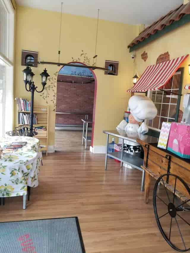 Culinary school event space with whimsical chef statue for cooking classes and parties.