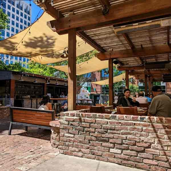Vibrant outdoor dining at SP2 Bar, perfect for casual meetings and networking events.