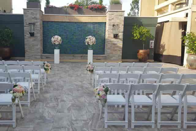 Private banquet space at Toll House Hotel with elegant floral arrangements for weddings.