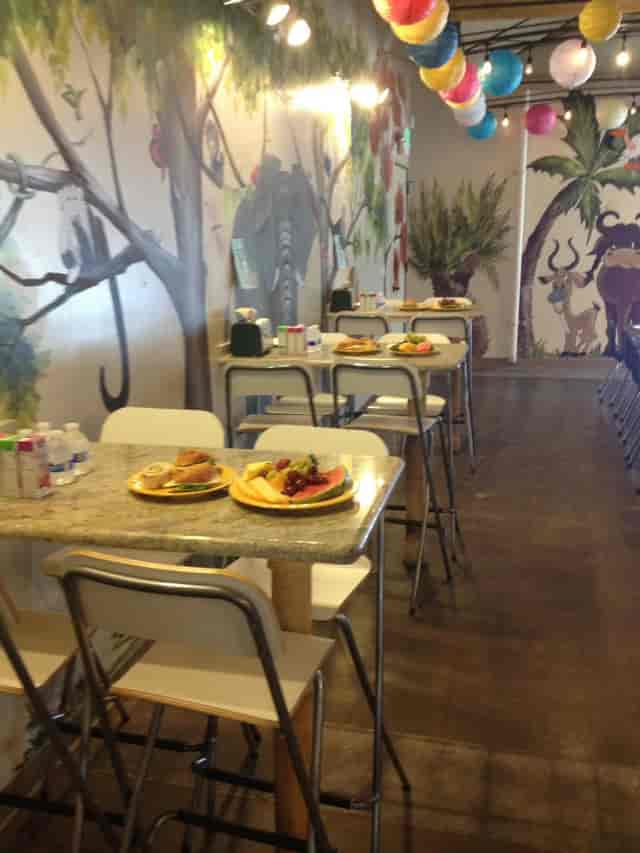 Dining room setup for event with fresh fruit, casual seating, and inviting ambiance.