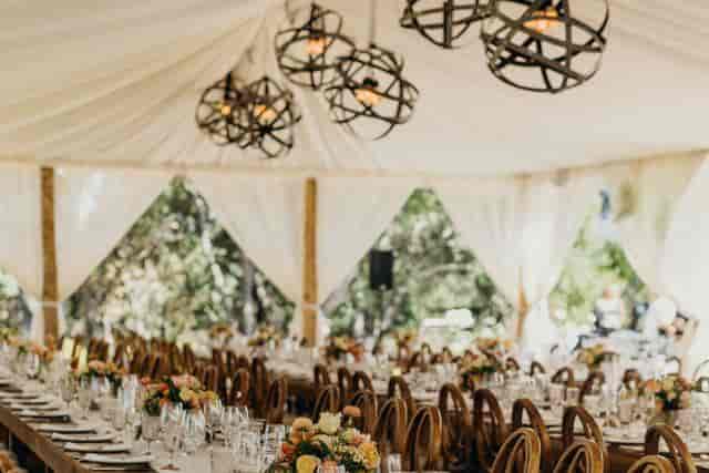 Elegant tented dining setup at Dynasty Restaurant for weddings and upscale events.
