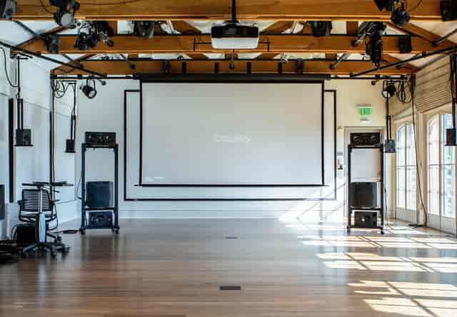 Stanford University music classroom with projection screen for events and presentations.