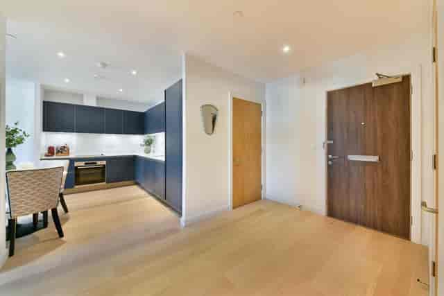 Modern entryway and sleek kitchen in Grace House, ideal for intimate gatherings and networking.