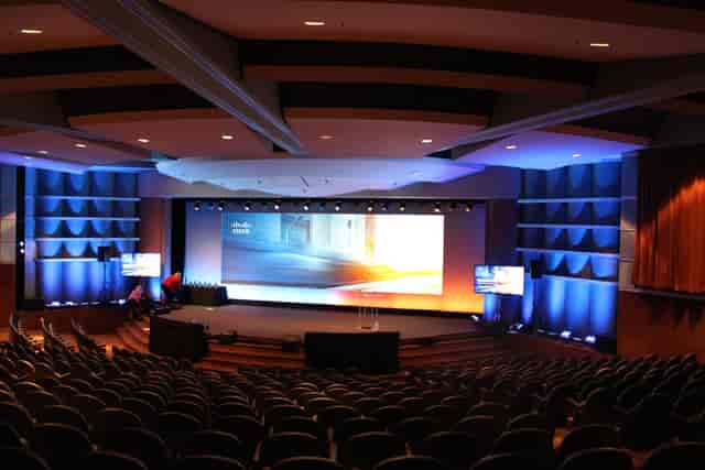 Santa Clara Convention Center theater with tiered seating for corporate events.