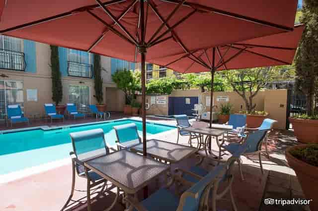 Poolside Bar at The Westin Palo Alto with vibrant umbrellas, ideal for networking events.