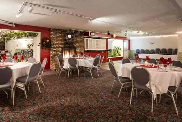 Elegant banquet space with round tables, ideal for events and gatherings at The Blue Pheasant.