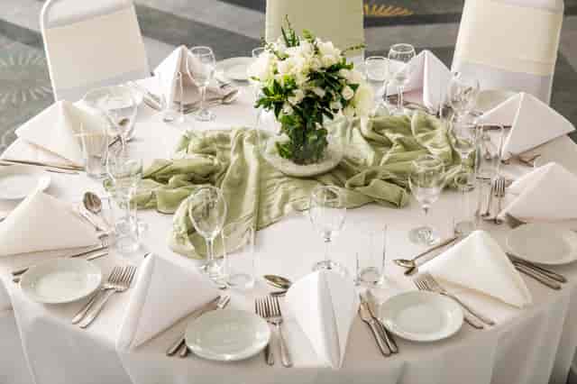 Elegant round table setup with fresh flowers at Mercure Bedford Centre Hotel for events.