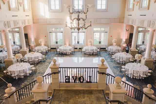 Elegant banquet facilities with round tables, ideal for weddings and formal gatherings.