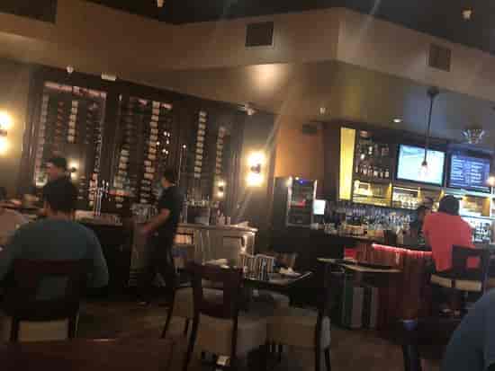 Cozy bar at The Oxford Kitchen, perfect for casual meetings and small events.